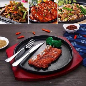 Cast iron hot sizzling plate on wooden tray - Image 6